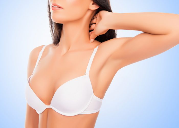 Close up portrait of shapely young woman in white bra